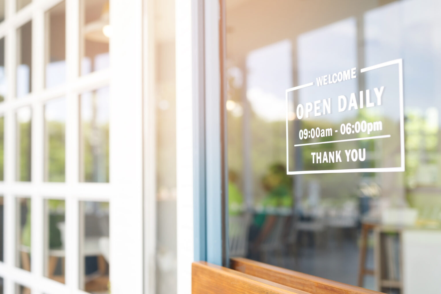 Welcome open sign on shop door. Text on cafe front or restaurant hang on door at entrance. vintage tone style. banner.